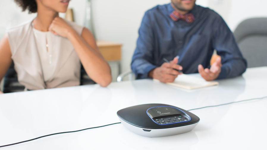 Logitech Group product sitting on conference room table