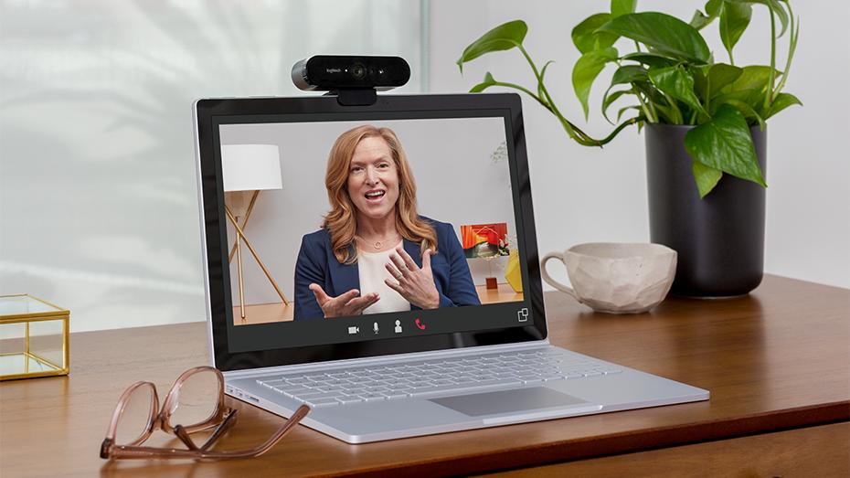 Logitech Brio webcam mounted on top of a laptop for a video conferencing call